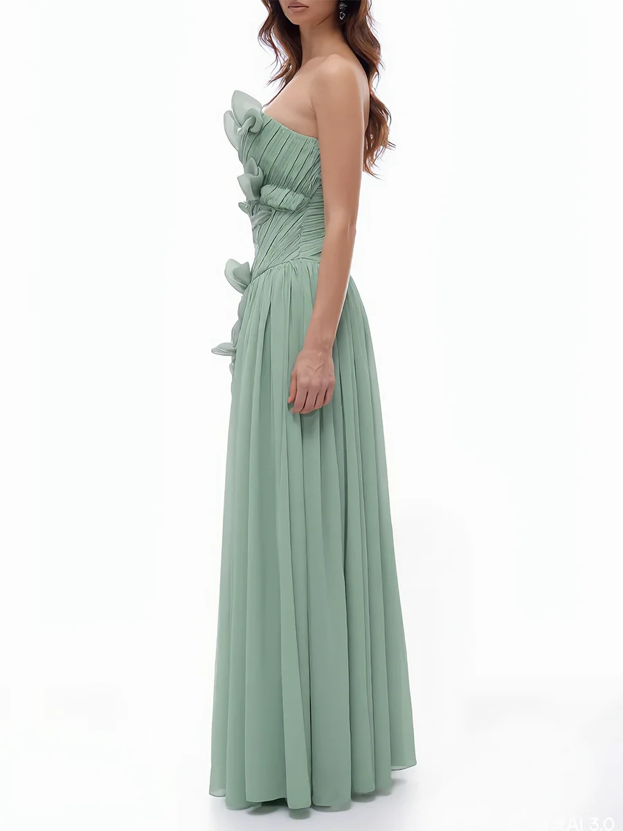 Side view of strapless ruffled floral applique gown