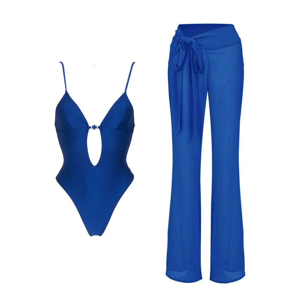 Blue monochrome two-piece swimwear set with cutout detail and matching flowing pants.