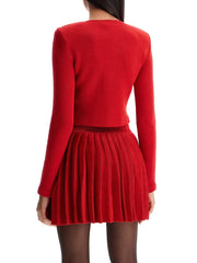 Model wearing a Heart-shaped Button Sweater and Skirts Suit from Golden Atelier.