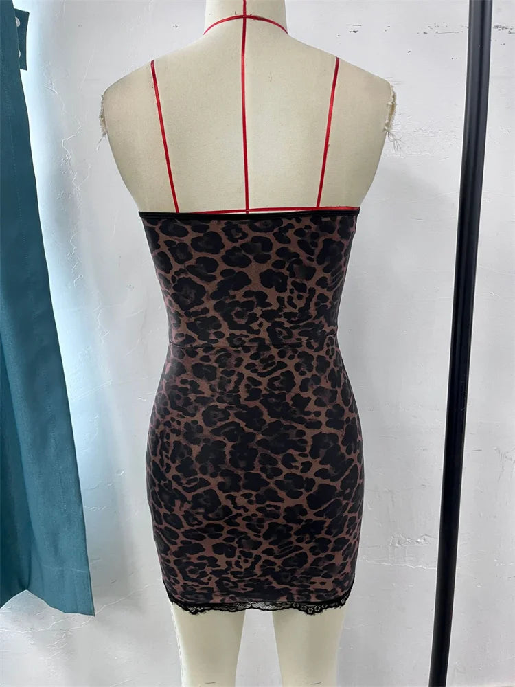 Leopard print dress on a mannequin with red straps 