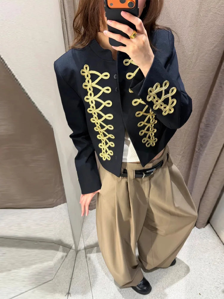 Close-up of gold embroidery on black Jacket