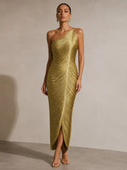Close-up of gold fringe detailing on one-shoulder dress