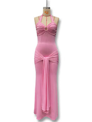 Pink evening gown on a mannequin against a white background
