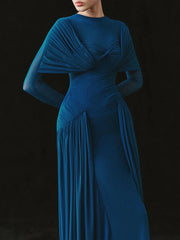 Blue evening gown with a draped design on a black background