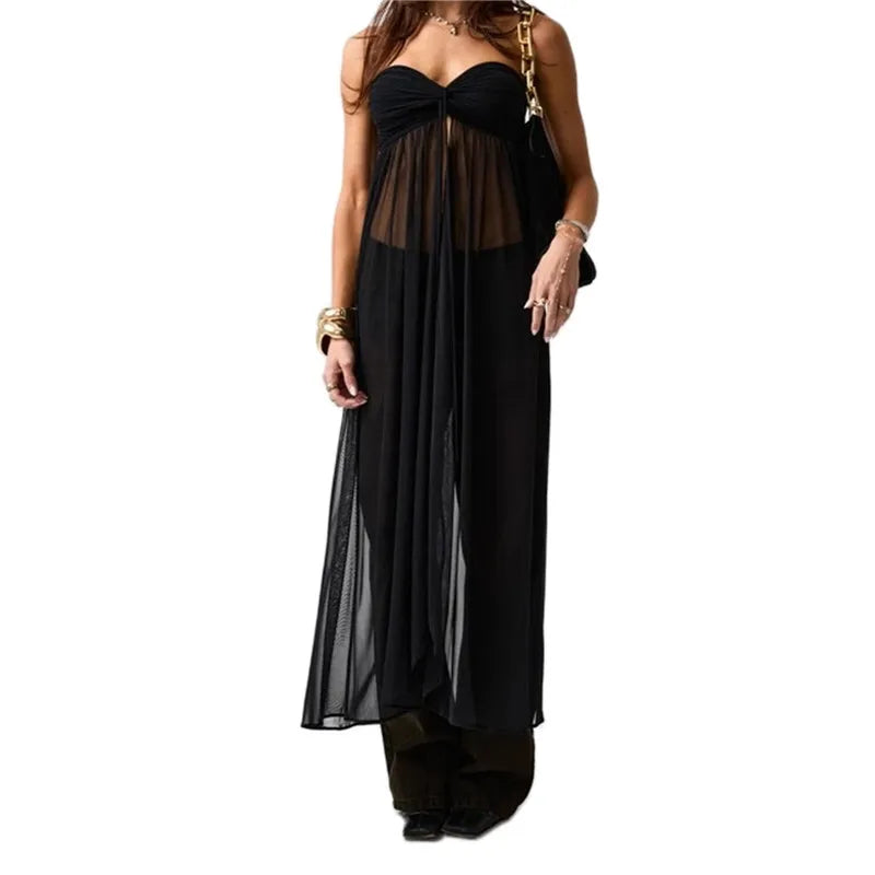 Black strapless dress with sheer overlay on a white background