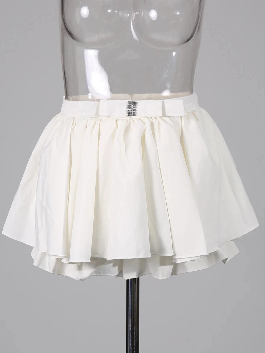 White skirt on a mannequin against a gray background