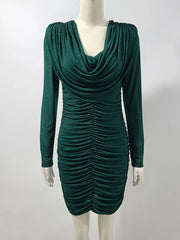 Green dress on a mannequin against a white background