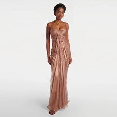 Model wearing a floor-length ruched spaghetti strap evening gown.