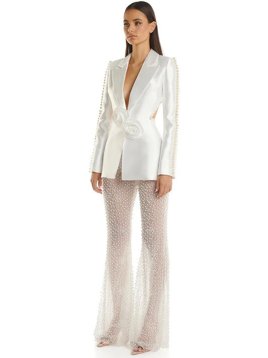 Pearl embellished cutout blazer and sheer beaded flare pants suit on model