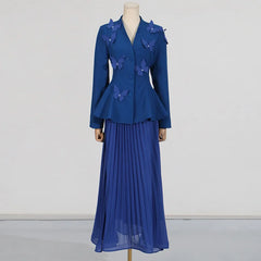 Blue dress with butterfly details on a mannequin against a white background
