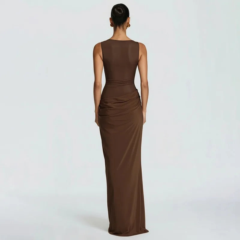 Woman wearing a brown evening gown on a white background