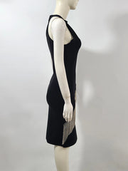 Black dress with fringe details on a mannequin against a white background