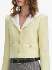 Light green textured blazer with white collar and black belt