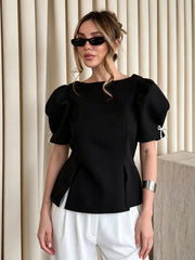 Black puff sleeve peplum blouse with boat neckline