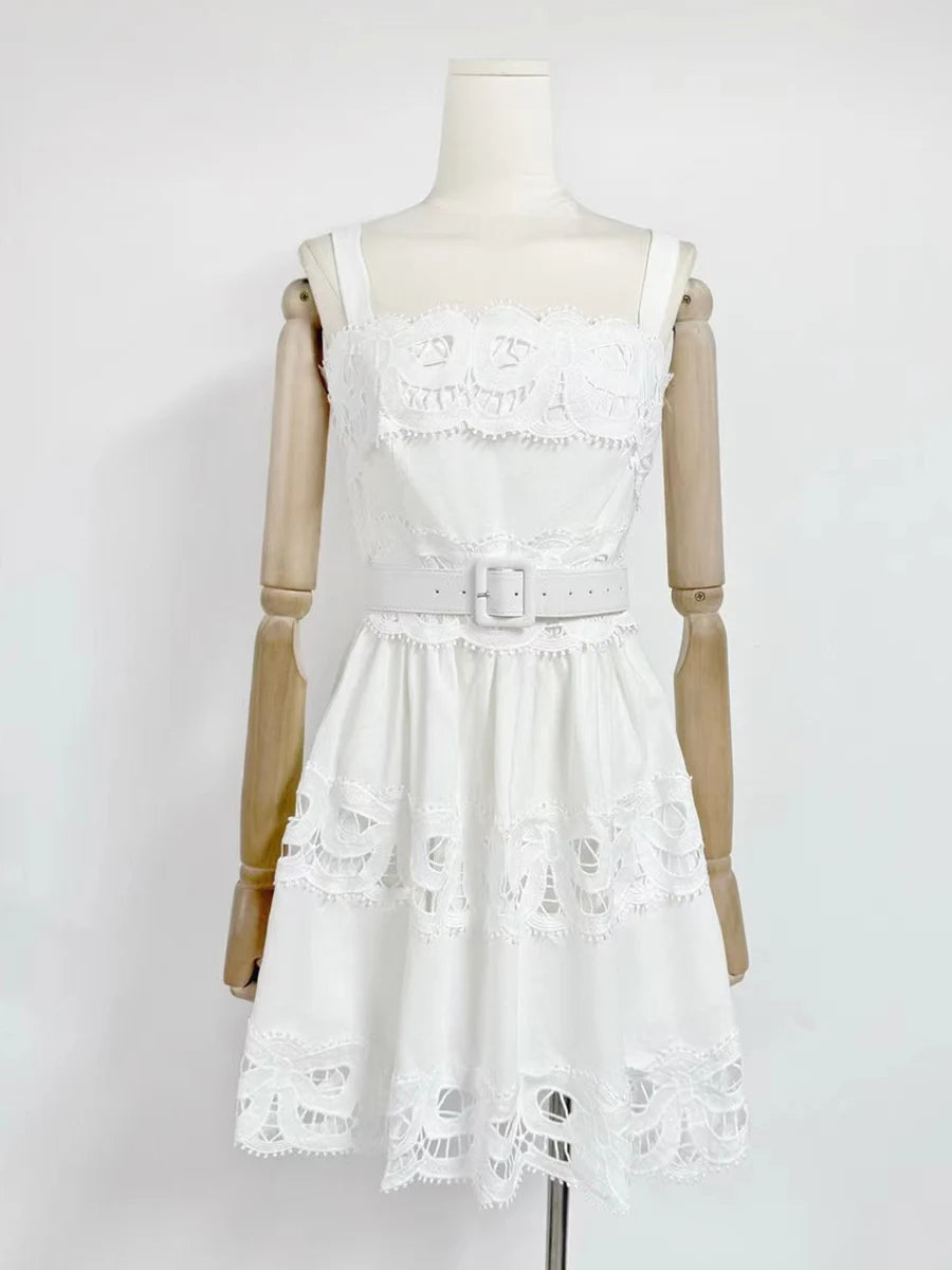 White lace dress on a mannequin against a white background