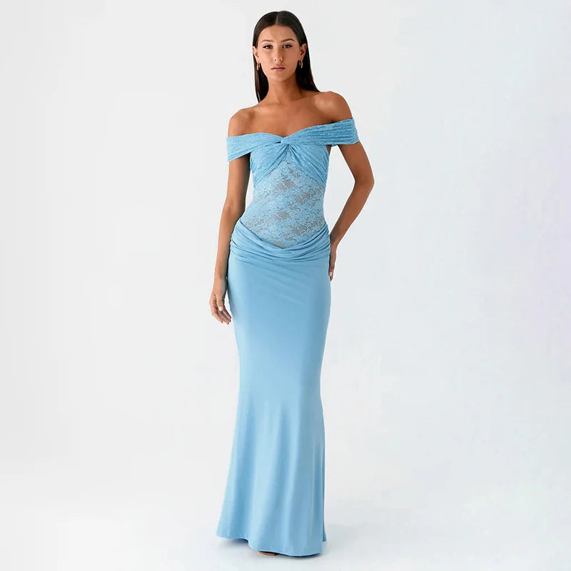 Woman wearing a light blue off-shoulder gown on a white background