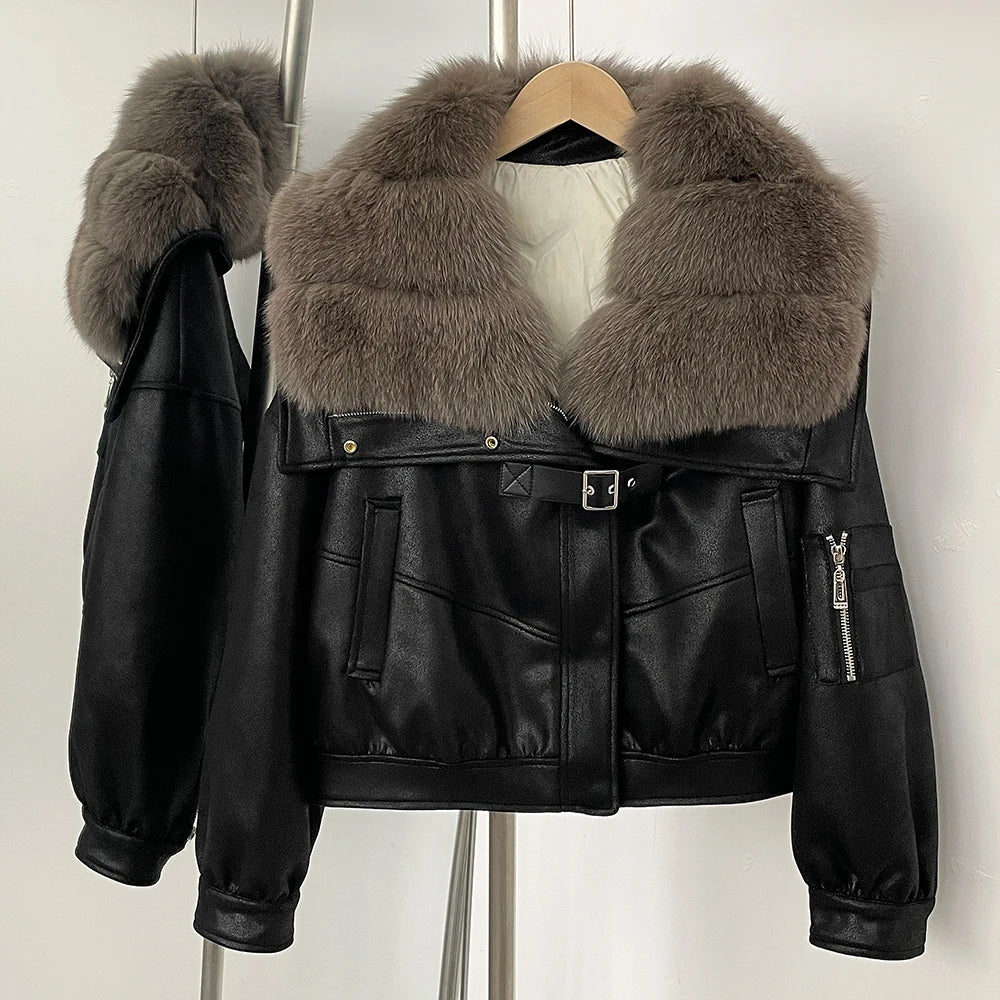 Black leather jacket with fur collar on a hanger against a white background