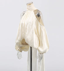 White dress on a mannequin against a white background