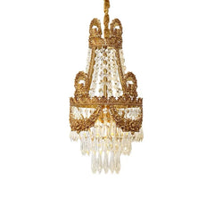 Gold chandelier with crystal accents on a white background