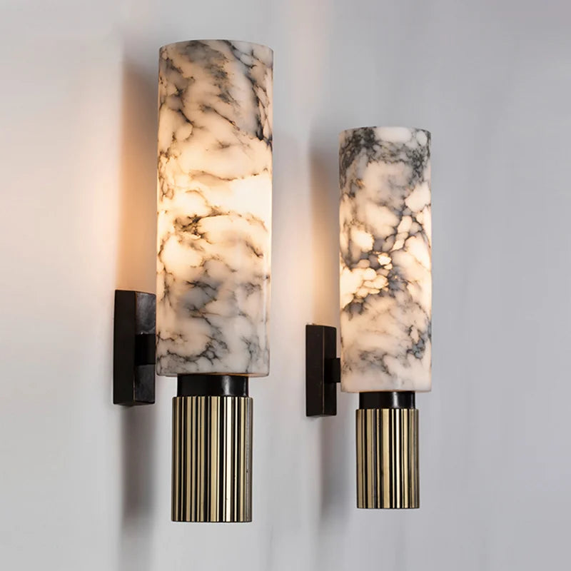 Close-up of a luxury marble wall sconce highlighting its natural veining and polished surface. A