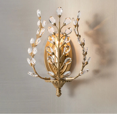 Decorative wall sconce with crystal accents on a neutral background