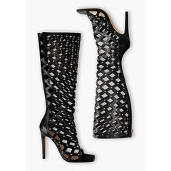Layout of cutout studded stiletto knee-high boots