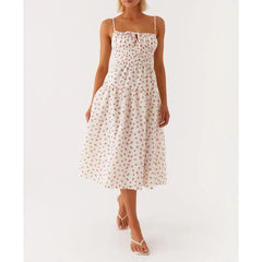 Woman wearing a floral dress on a white background