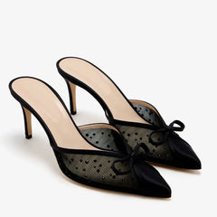 Black mesh stiletto pumps with polka dots and a bow