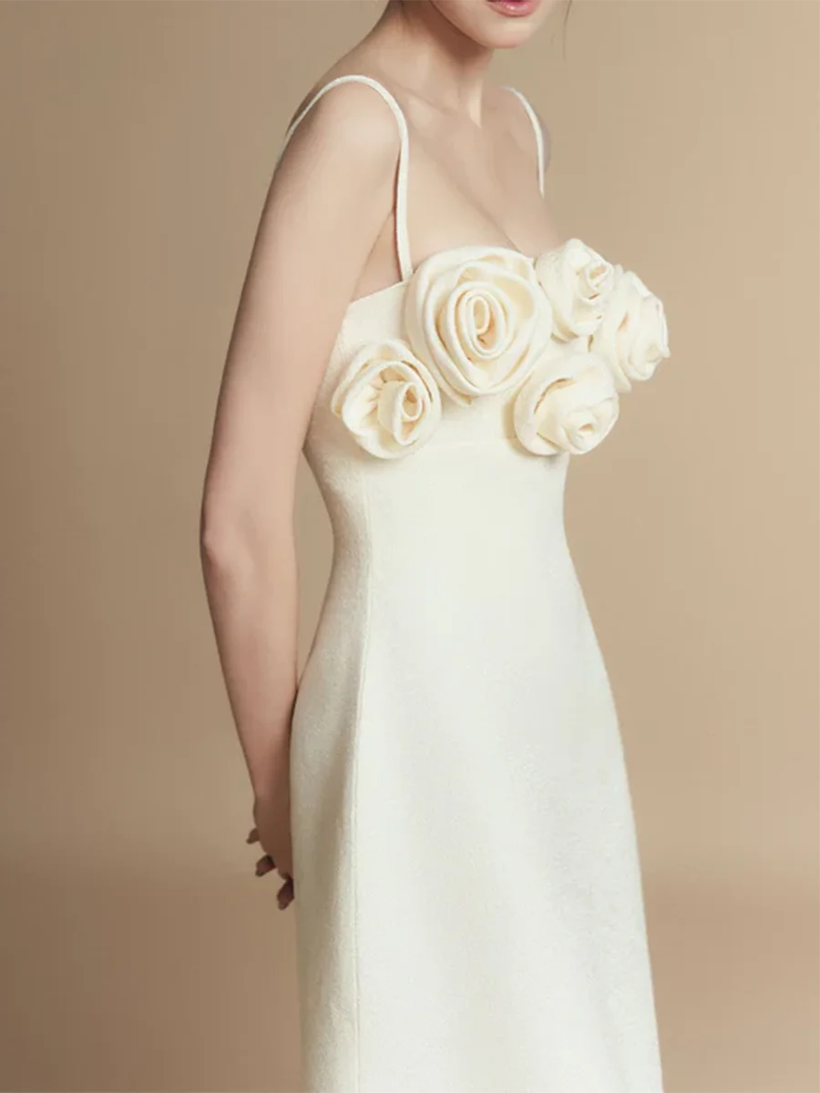 White wedding dress with floral details on a beige background