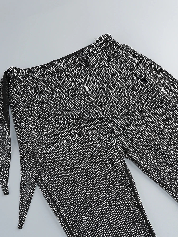 Black and white patterned pants on a light gray background