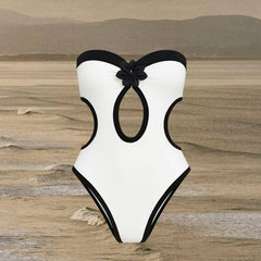 Product shot of one piece swimsuit with cutouts
