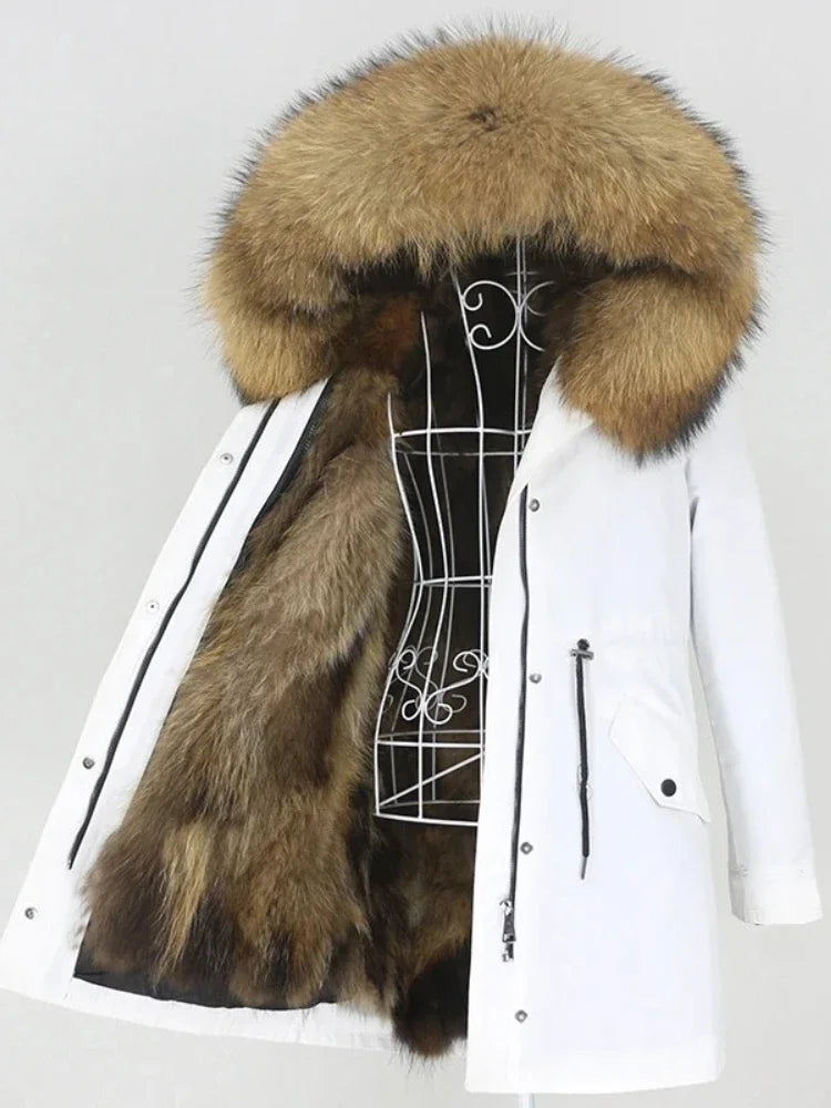 White parka with a large fur hood on a mannequin against a white background
