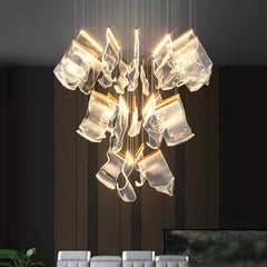 Cluster of pendant lights hanging in a cozy living room, adding a touch of warmth and style.  Golden Atelier 3