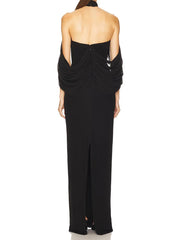 Black halter neck gown with open back on a white background