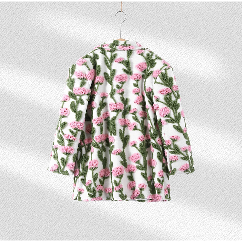 Floral patterned shirt on a hanger against a white background