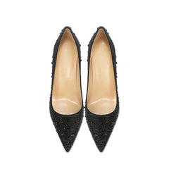 Pair of black pointed-toe high heels 