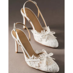White lace slingback heels with butterfly knot detail