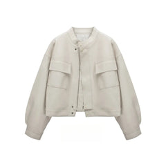 Beige cropped faux leather jacket with round neck and dual front pockets.