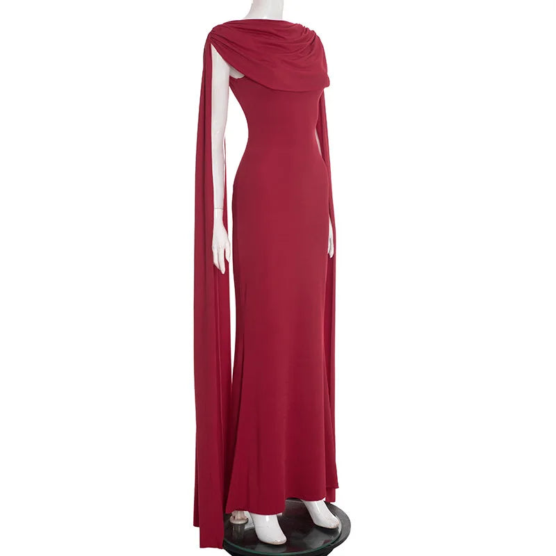 Red evening gown on a mannequin against a white background