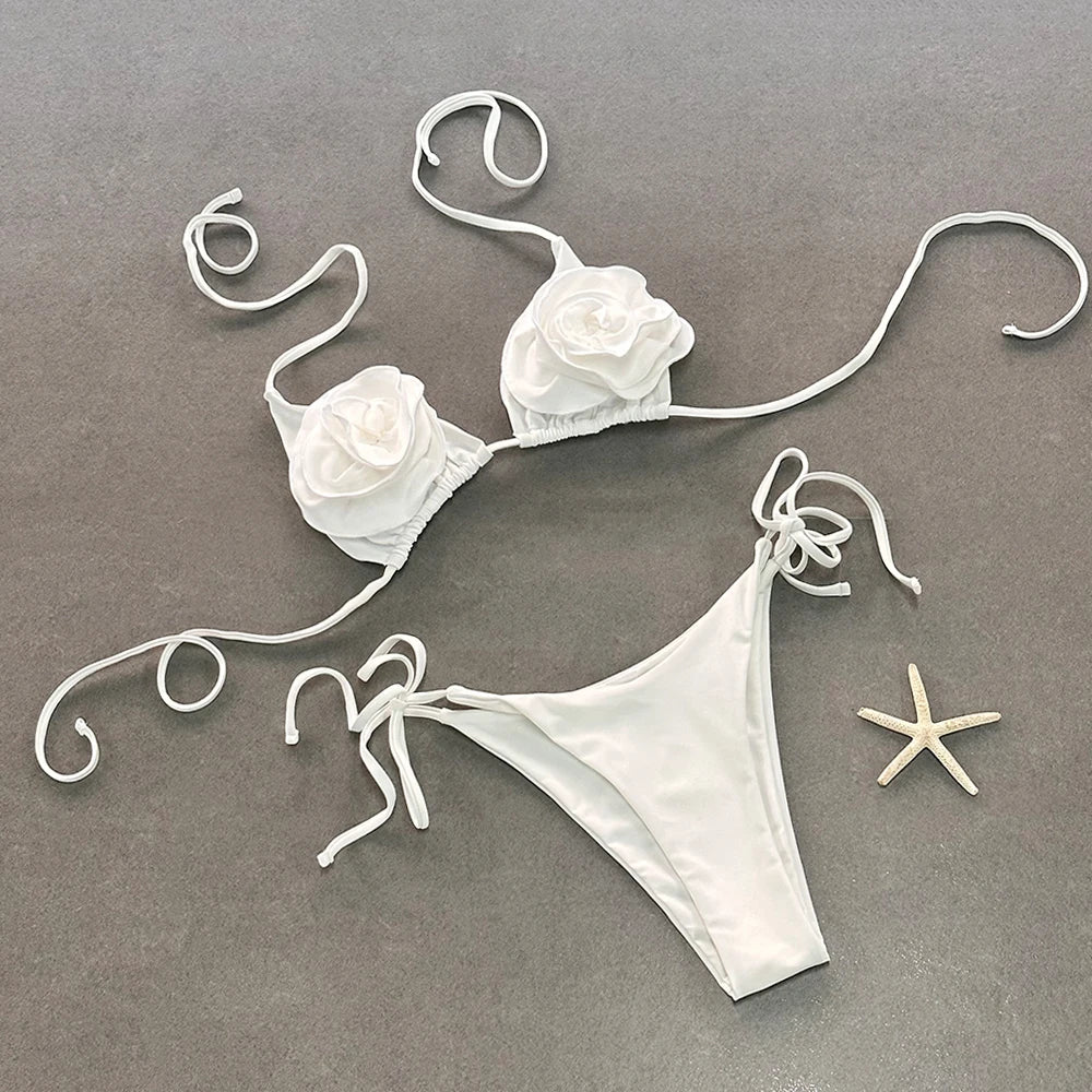 White embellished bikini set laid flat