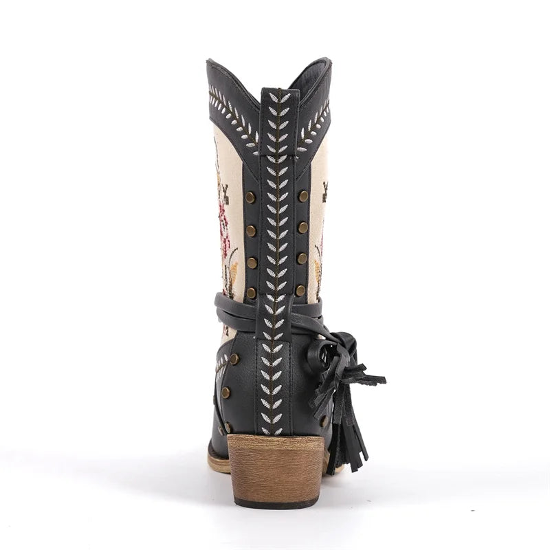 Back view of black embroidered western ankle boots showing heel and embroidery.