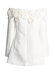 White blouse with floral lace details on a white background