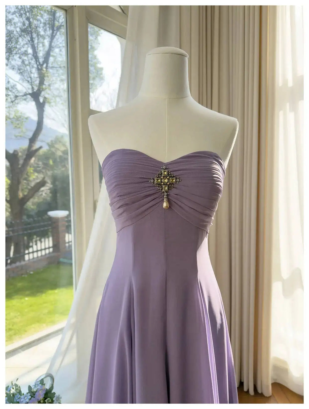 Close-up of embellished bodice on strapless a-line maxi dress