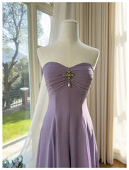 Close-up of embellished bodice on strapless a-line maxi dress