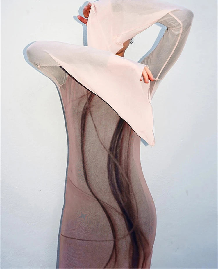 Close-up of sheer mesh maxi dress with bell sleeves and abstract print