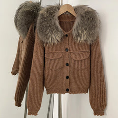 Brown ribbed knit jacket with a large natural fox fur collar.