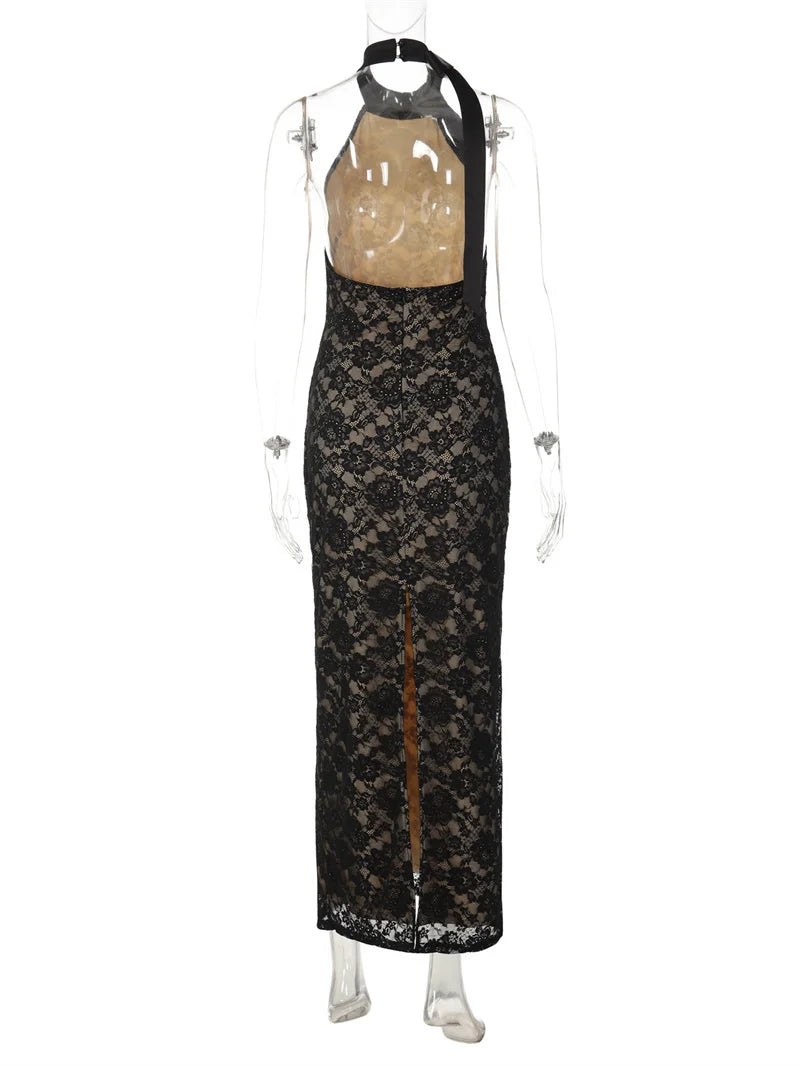 Black lace dress on a mannequin against a white background