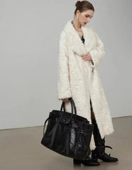  Women's shaggy faux fur coat with a large lapel.