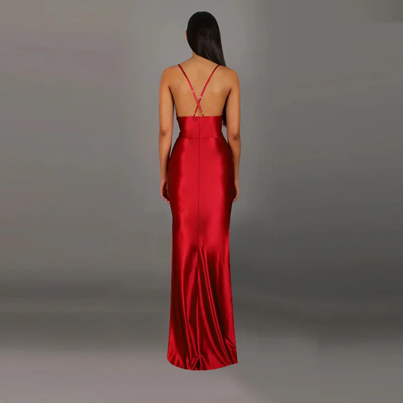 Red evening gown with a backless design on a gray background