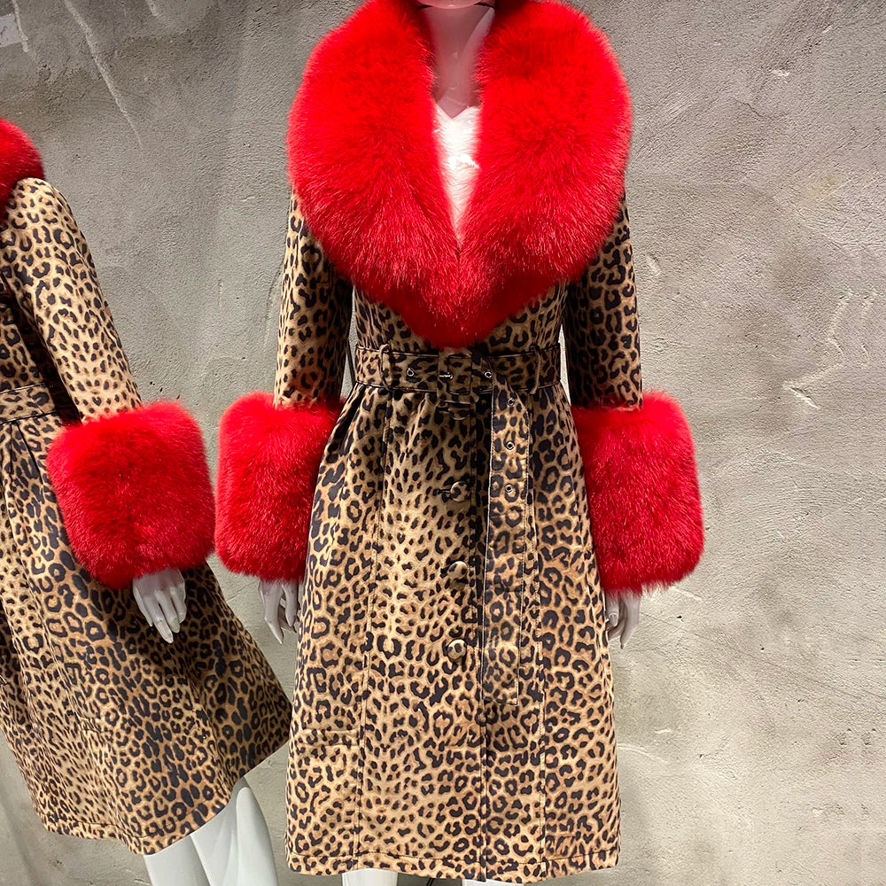 Leopard print coat with red fur trim on a textured gray background